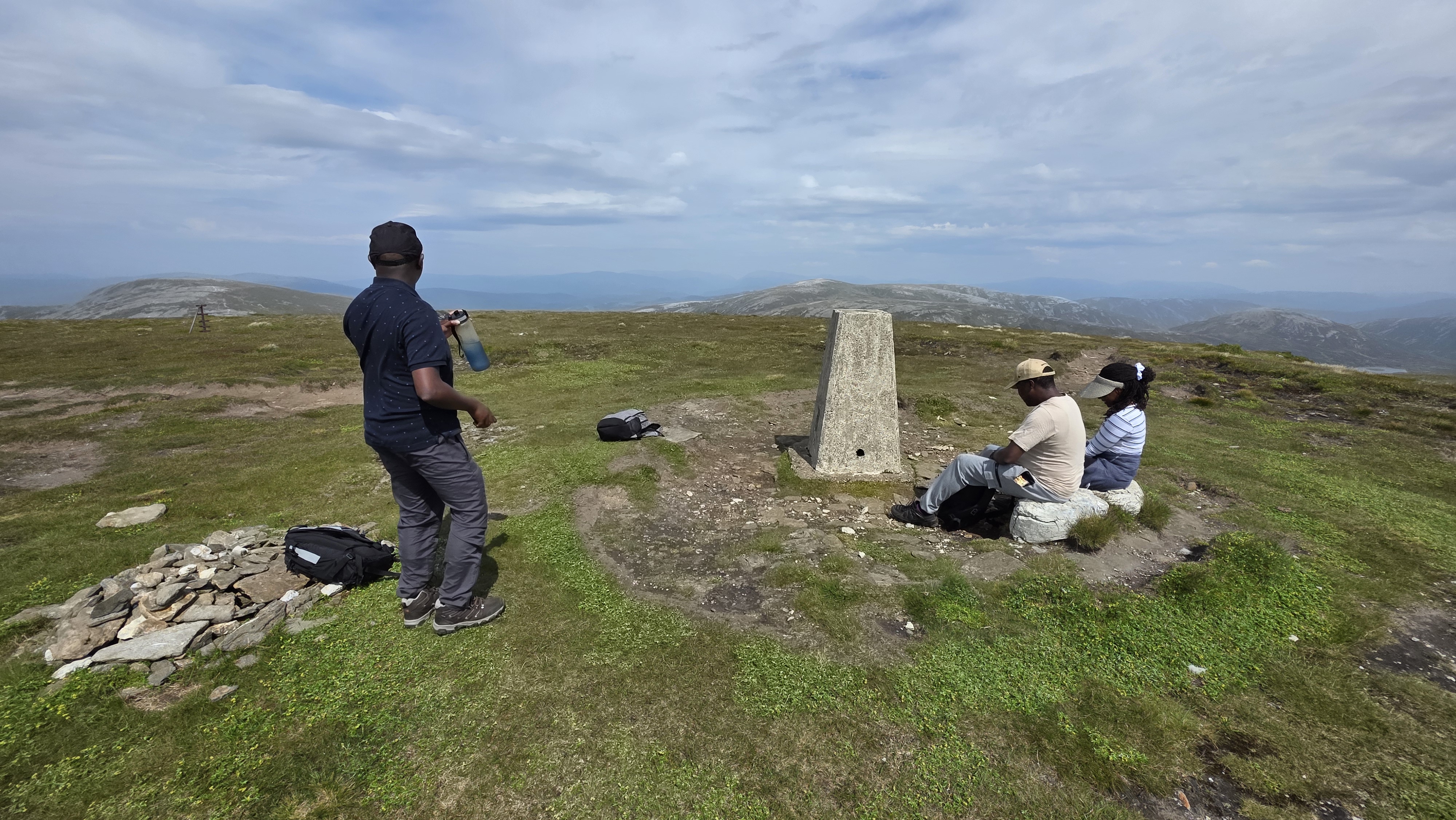 Taking in the vast summit views of Glas Tulaichean